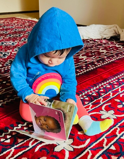 Baby exploring board book