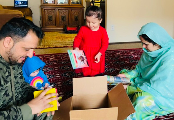Family opening their box of books