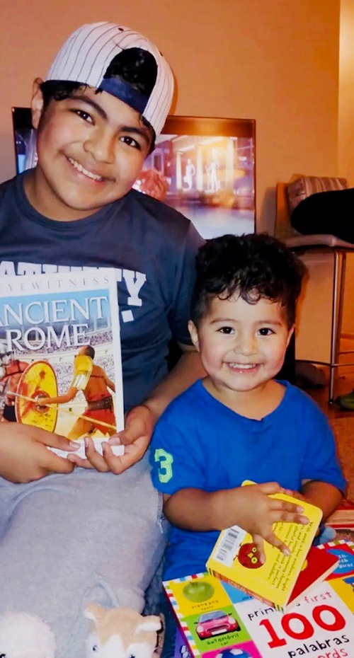 brothers receive books from A Book of My Own