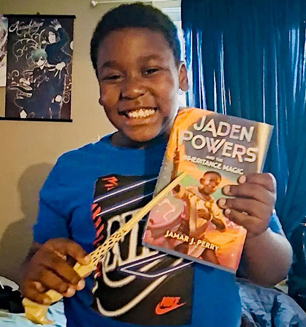 boy receives Jaden Powers book from A Book of My Own